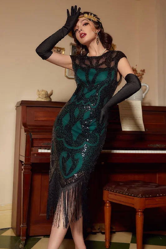 Robe à paillettes noires et vertes des années 20 avec gland